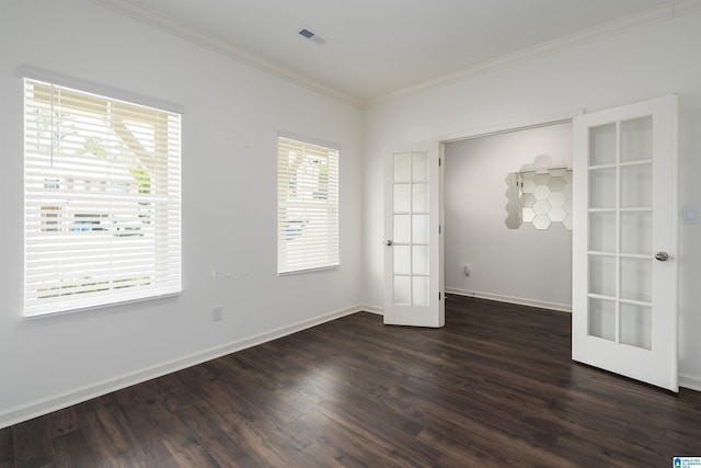 unfurnished room featuring dark wood finished floors, french doors, crown molding, and baseboards