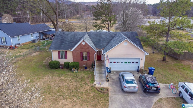 ranch-style house with a garage, brick siding, a shingled roof, fence, and driveway