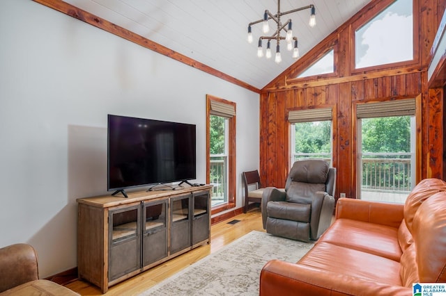 living room featuring lofted ceiling, a chandelier, visible vents, wood ceiling, and light wood finished floors