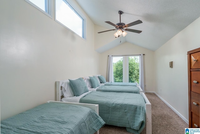 carpeted bedroom with lofted ceiling, ceiling fan, and baseboards