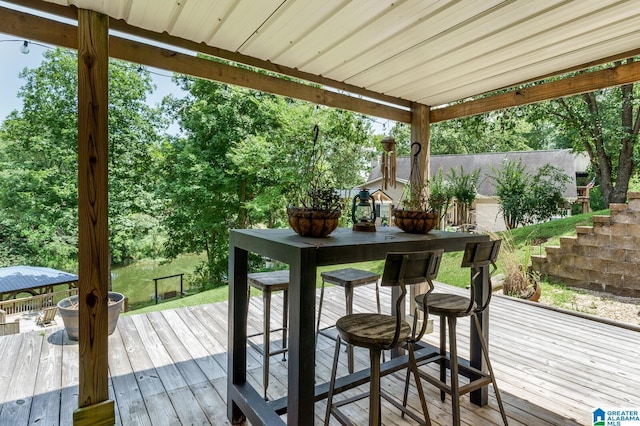 exterior space with a healthy amount of sunlight and hardwood / wood-style floors