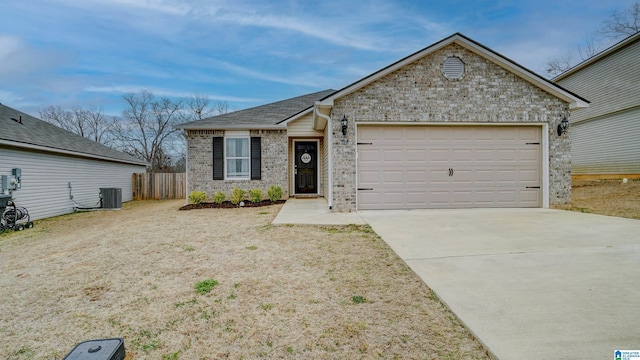 single story home featuring an attached garage, central air condition unit, brick siding, fence, and driveway