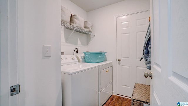 laundry room featuring laundry area, separate washer and dryer, and dark wood-style flooring