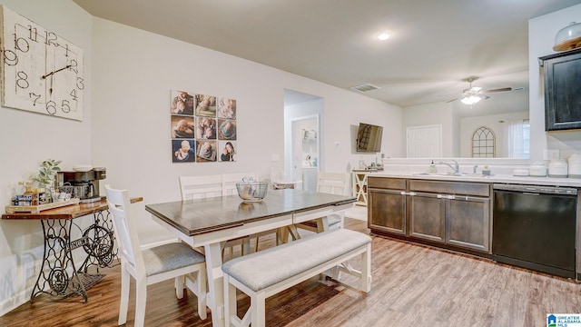 dining room featuring ceiling fan, baseboards, visible vents, and light wood-style floors