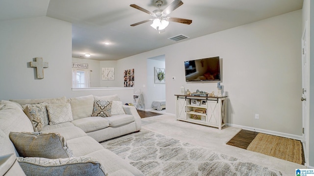 living area with ceiling fan, carpet floors, visible vents, and baseboards