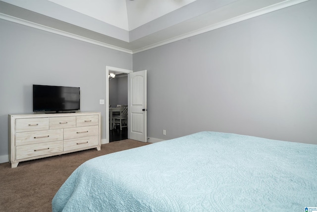 bedroom with dark colored carpet and crown molding