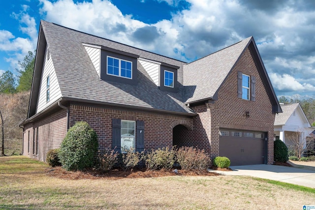 view of front facade featuring brick siding, a shingled roof, a front lawn, a garage, and driveway