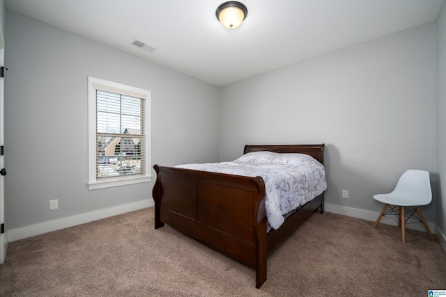 bedroom featuring carpet, visible vents, and baseboards