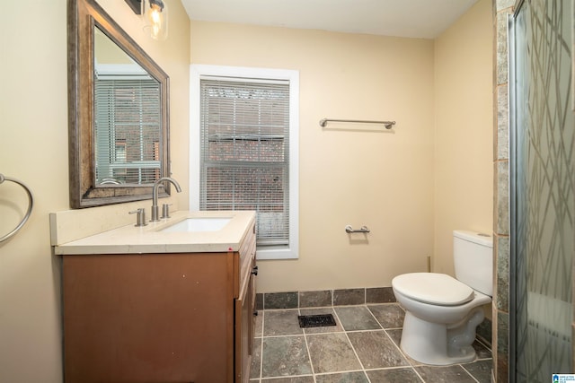 bathroom featuring toilet and vanity