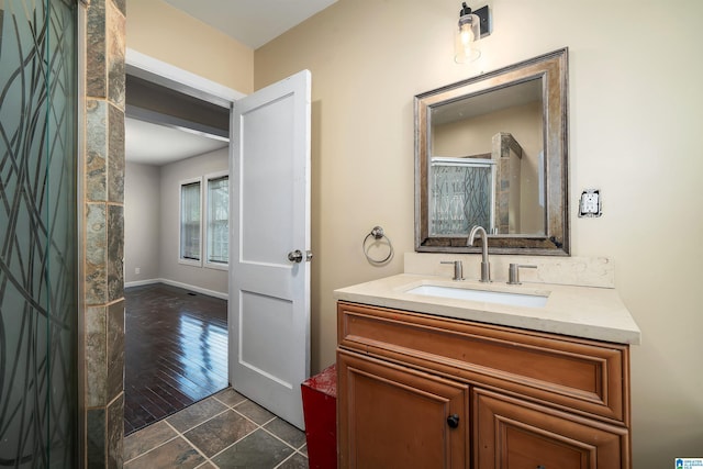 bathroom with vanity and baseboards