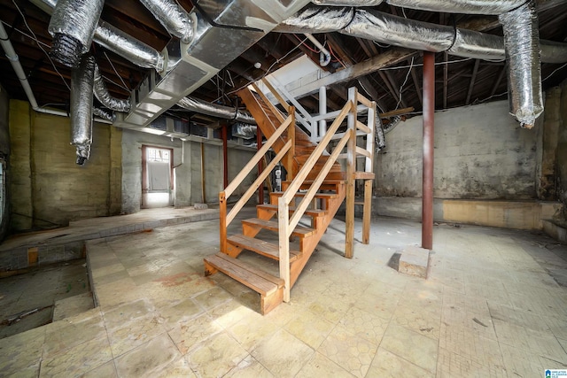 unfinished basement with stairs