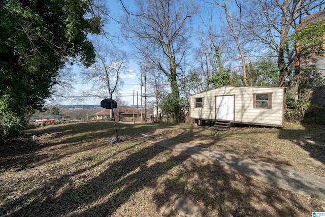 view of yard with an outbuilding and entry steps