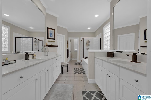 full bath with a shower stall, a sink, and tile patterned floors