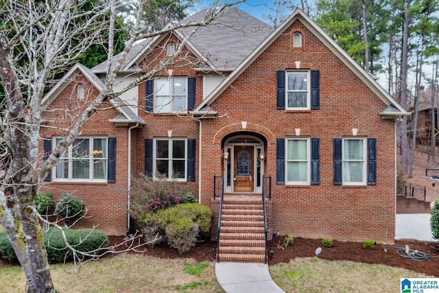 view of front of house featuring brick siding