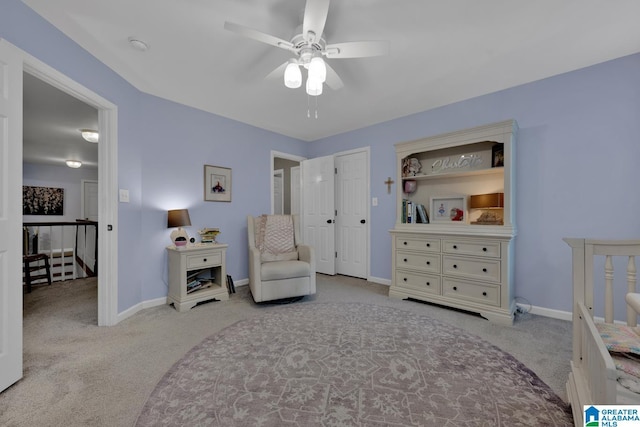 living area featuring carpet floors, an upstairs landing, and baseboards