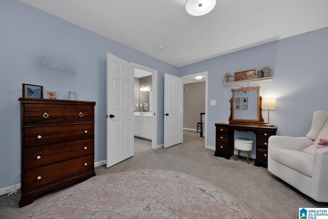 living area featuring light carpet and baseboards