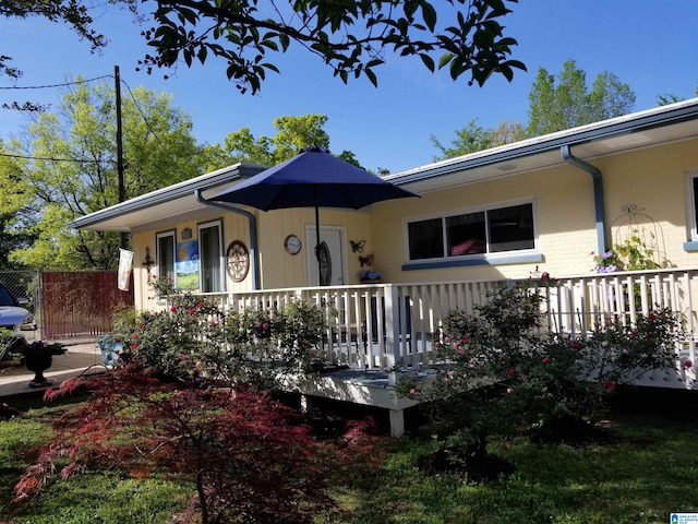 view of front of home featuring a porch and brick siding