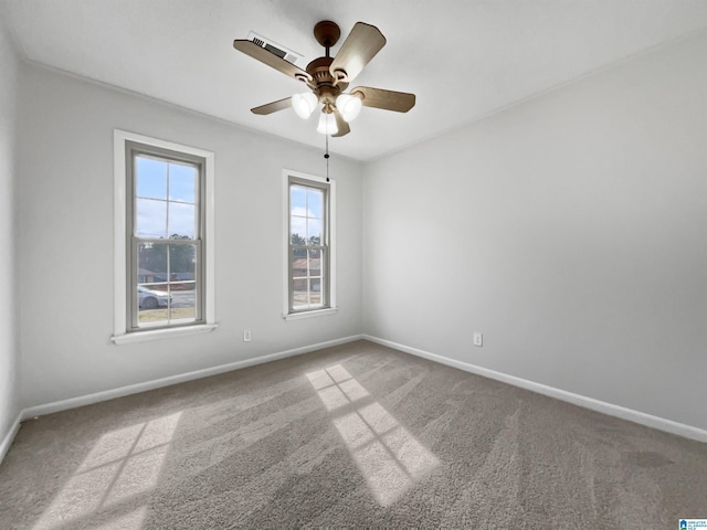 unfurnished room with ceiling fan, carpet floors, and baseboards