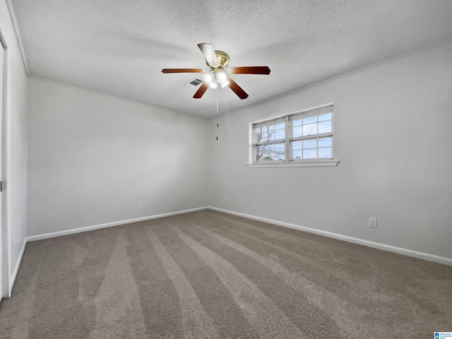 carpeted spare room featuring a textured ceiling, a ceiling fan, visible vents, and baseboards