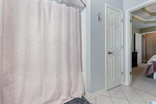 full bath with curtained shower, baseboards, ornamental molding, and tile patterned floors