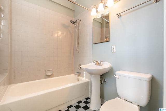 full bath featuring toilet, shower / bath combination, and tile patterned floors