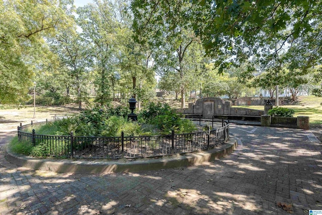 view of property's community featuring fence