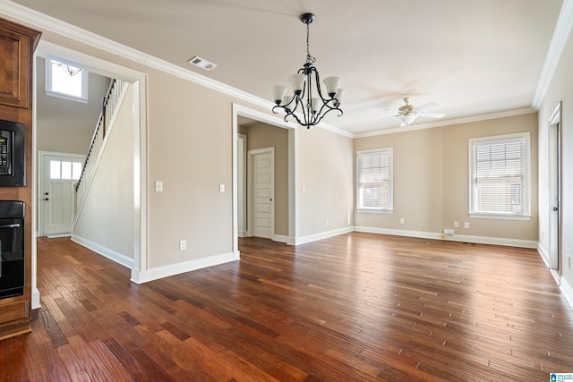 interior space featuring dark wood-style floors, visible vents, a wealth of natural light, and ornamental molding