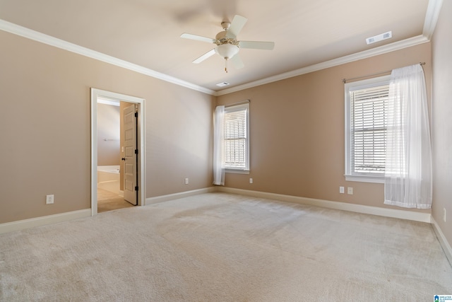 unfurnished room with visible vents, light colored carpet, and ornamental molding