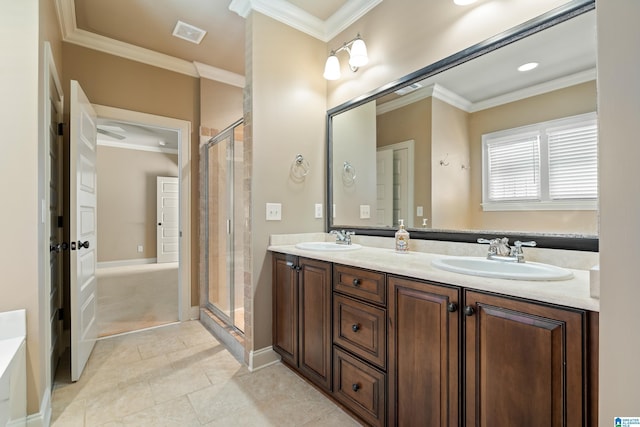 full bathroom featuring visible vents, ornamental molding, a stall shower, and a sink