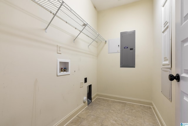 washroom with laundry area, hookup for a washing machine, electric panel, and baseboards