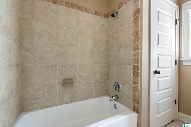 bathroom with washtub / shower combination