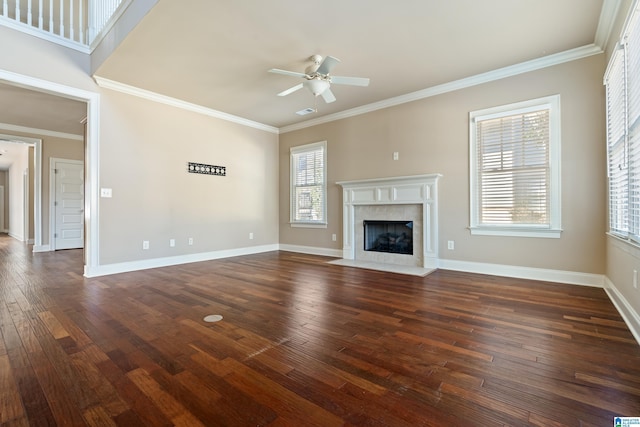 unfurnished living room featuring baseboards, dark wood-style floors, a ceiling fan, and ornamental molding