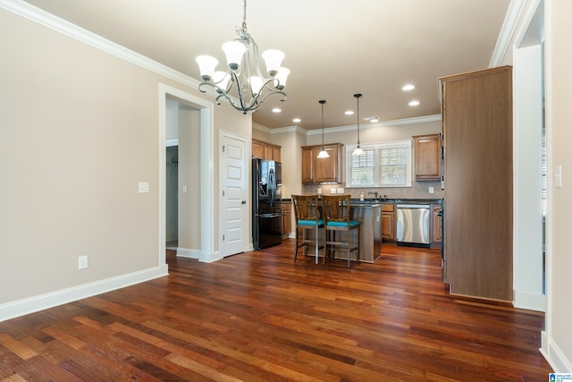 kitchen featuring black fridge with ice dispenser, stainless steel dishwasher, dark countertops, a chandelier, and a center island