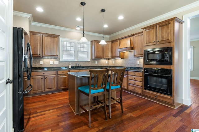 kitchen with dark countertops, premium range hood, black appliances, dark wood-type flooring, and crown molding