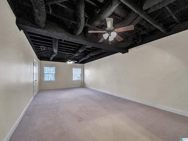 carpeted spare room with baseboards