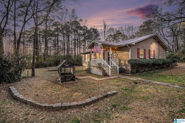 property exterior at dusk featuring metal roof