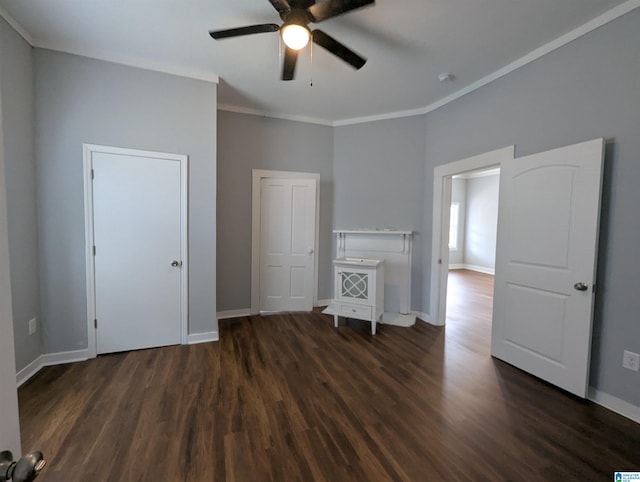 unfurnished bedroom featuring baseboards, ornamental molding, and wood finished floors