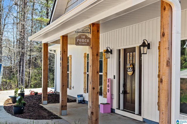 doorway to property featuring covered porch