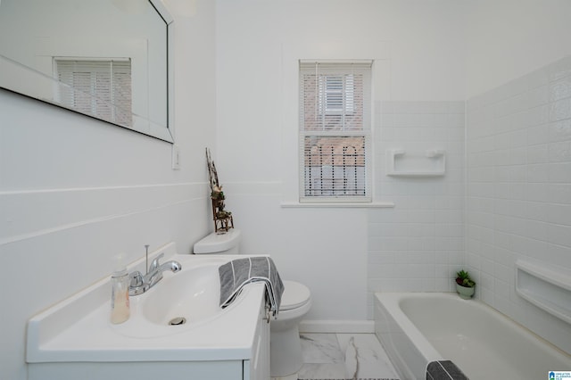 bathroom featuring marble finish floor, baseboards, vanity, and toilet