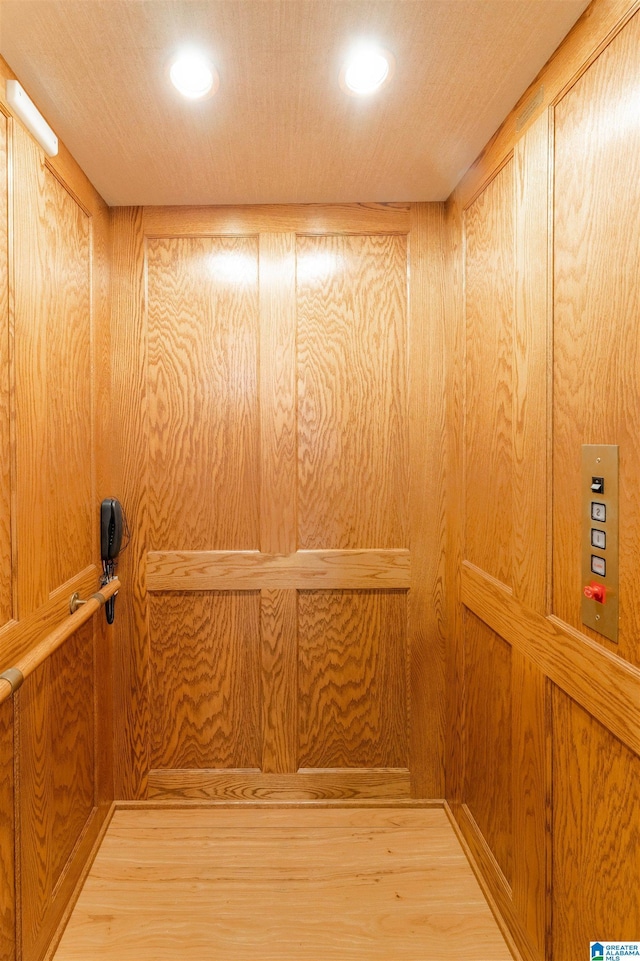 interior details featuring recessed lighting and elevator