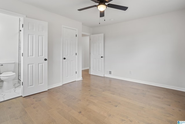 unfurnished bedroom with baseboards, visible vents, and light wood finished floors