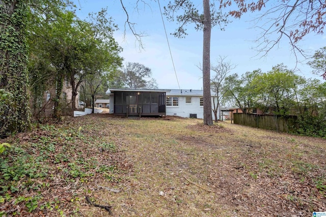 back of house with a sunroom and fence