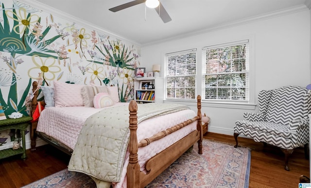 bedroom with multiple windows, wood finished floors, baseboards, and ornamental molding