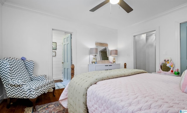 bedroom with ornamental molding, ceiling fan, and wood finished floors