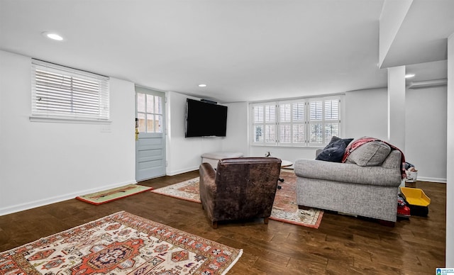 living room with recessed lighting, baseboards, and hardwood / wood-style flooring