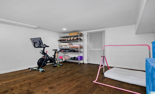 workout area with recessed lighting, baseboards, and wood finished floors