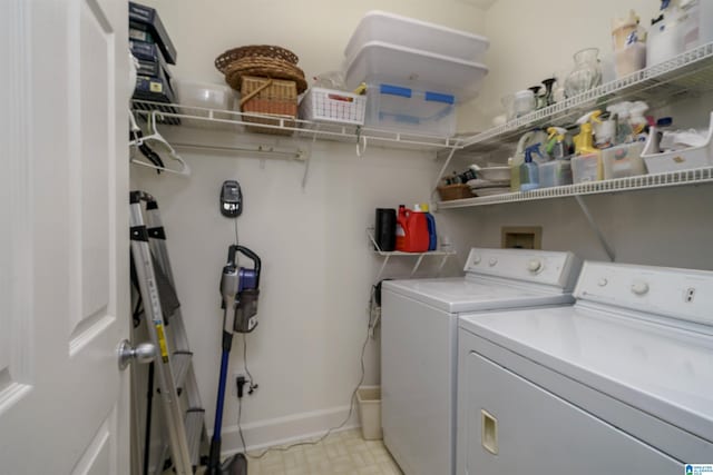 washroom featuring laundry area, light floors, independent washer and dryer, and baseboards