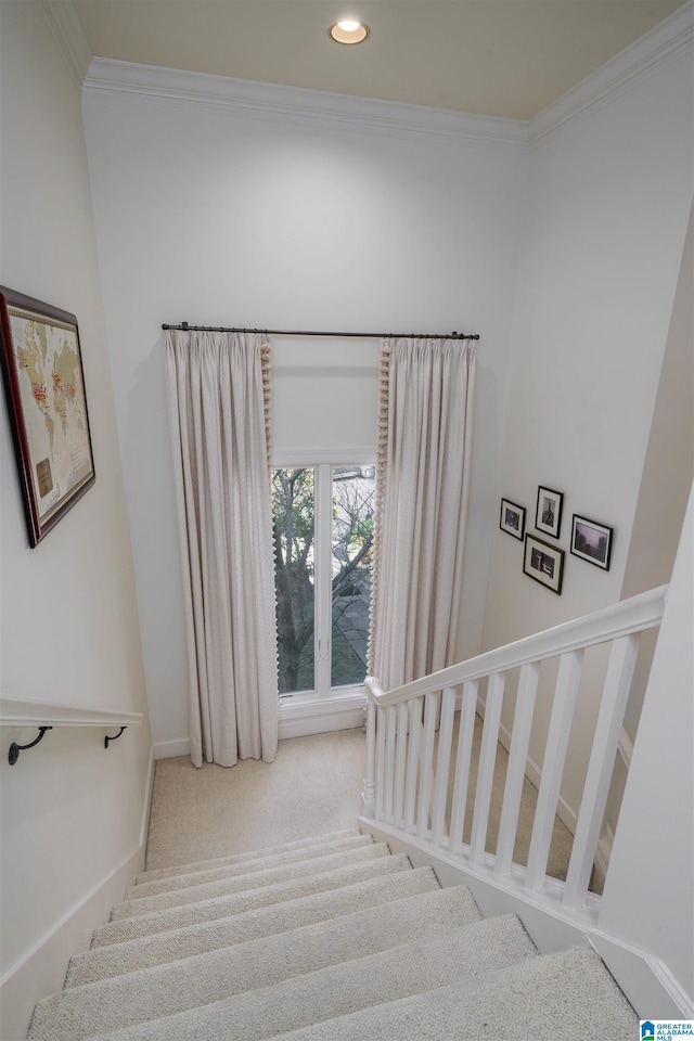 staircase with ornamental molding, carpet, recessed lighting, and baseboards