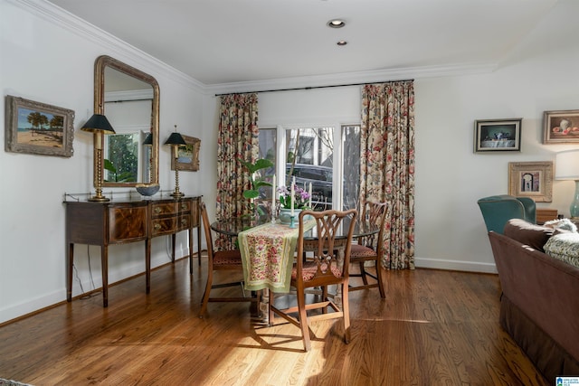 dining area with recessed lighting, baseboards, crown molding, and wood finished floors