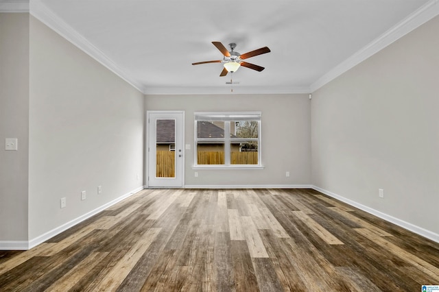 empty room featuring a ceiling fan, baseboards, ornamental molding, and wood finished floors